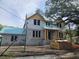 View of a two-story home under construction with block walls and wood framing, awaiting finishing touches at 515 Bosphorous Ave, Tampa, FL 33606