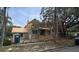 Two-story home under construction with a mix of modern design and traditional elements in a sunny, tree-lined neighborhood at 515 Bosphorous Ave, Tampa, FL 33606