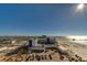 Sweeping aerial view captures the hotel, beach, ocean, and cityscape from the residential property at 10 Papaya St # 1404, Clearwater Beach, FL 33767