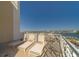 Spacious balcony featuring lounge chairs and seating for relaxing while enjoying the breathtaking ocean views at 10 Papaya St # 1404, Clearwater Beach, FL 33767