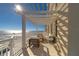 Charming balcony with pergola, comfy seating, and stunning views at 10 Papaya St # 1404, Clearwater Beach, FL 33767