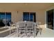 Inviting outdoor balcony features a dining table and chairs, perfect for enjoying meals with a view at 10 Papaya St # 1404, Clearwater Beach, FL 33767