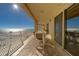 Spacious balcony with ocean view, dining table, and comfortable seating, perfect for outdoor relaxation and entertaining at 10 Papaya St # 1404, Clearwater Beach, FL 33767