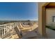 Relax on this balcony that overlooks the ocean and city with comfortable lounge chairs and plenty of space at 10 Papaya St # 1404, Clearwater Beach, FL 33767