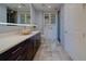 Beautiful bathroom featuring a stylish vanity, vessel sink, ample storage and decorative lighting at 10 Papaya St # 1404, Clearwater Beach, FL 33767