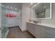 Modern bathroom with a glass shower, sleek vanity, ample storage and decorative lighting at 10 Papaya St # 1404, Clearwater Beach, FL 33767