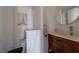 Chic powder room with modern vanity and decorative wall art at 10 Papaya St # 1404, Clearwater Beach, FL 33767