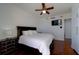 Bedroom boasts gleaming hardwood floors, ceiling fan and balcony access at 10 Papaya St # 1404, Clearwater Beach, FL 33767
