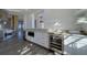 Modern kitchen features stainless steel appliances, white cabinets, wine cooler and light wood floors at 10 Papaya St # 1404, Clearwater Beach, FL 33767