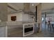 Modern kitchen features stainless steel appliances, range hood and open concept design at 10 Papaya St # 1404, Clearwater Beach, FL 33767