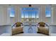 Bright living room with floor to ceiling windows showcasing water views and contemporary decor at 10 Papaya St # 1404, Clearwater Beach, FL 33767