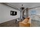 Open-concept living room features modern lighting, a flatscreen TV, and stylish decor in a modern space at 10 Papaya St # 1404, Clearwater Beach, FL 33767