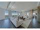 Spacious living room with water views, industrial style ceilings, and modern decor at 10 Papaya St # 1404, Clearwater Beach, FL 33767
