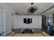 Bright living room features sleek design elements with flatscreen TV, modern lighting, and open floorplan at 10 Papaya St # 1404, Clearwater Beach, FL 33767