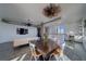 Open living space with modern decor, dining area, and a kitchen with bar seating, bathed in natural light at 10 Papaya St # 1404, Clearwater Beach, FL 33767