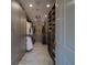 Spacious walk-in closet with custom shelving, cabinets, drawers, and decorative ceiling light at 10 Papaya St # 1404, Clearwater Beach, FL 33767