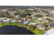 Waterfront real estate showcasing neighborhood and community features, plus a pond view with mature trees at 10828 99Th Pl, Seminole, FL 33772