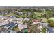 Aerial view showcases the community's proximity to the golf course and mature trees at 11308 Pocket Brook Dr, Tampa, FL 33635