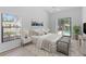 Well-lit bedroom with sliding glass doors to the patio and pool at 11308 Pocket Brook Dr, Tampa, FL 33635