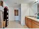 Bathroom with wooden cabinets and a stained glass window at 12239 Fawn Brindle St, Riverview, FL 33578
