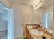 Bathroom featuring double sink vanity with a framed mirror and neutral walls at 12239 Fawn Brindle St, Riverview, FL 33578
