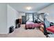 Bedroom with black canopy bed, TV and a rolling desk chair at 12239 Fawn Brindle St, Riverview, FL 33578