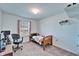 Bright bedroom with a neutral color palette and a large window at 12239 Fawn Brindle St, Riverview, FL 33578