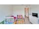 Playful bedroom featuring a crib, toys, and storage furniture at 12239 Fawn Brindle St, Riverview, FL 33578