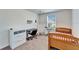Bright bedroom features neutral walls, carpet flooring, and a full workstation at 12239 Fawn Brindle St, Riverview, FL 33578