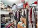 Walk-in closet with clothes, shelving, boxes and desk area at 12239 Fawn Brindle St, Riverview, FL 33578