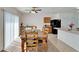 Comfortable dining area with view of the kitchen and plenty of natural light at 12239 Fawn Brindle St, Riverview, FL 33578