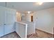 Upstairs hallway with multiple doors and carpeted floor at 12239 Fawn Brindle St, Riverview, FL 33578