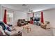 Cozy living room offers comfortable seating, natural light from large windows, and a relaxing atmosphere at 12239 Fawn Brindle St, Riverview, FL 33578