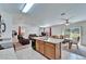 Open-concept kitchen with island, living, and dining area perfect for entertaining at 12239 Fawn Brindle St, Riverview, FL 33578