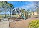 Community playground featuring slides and a scenic view of the water at 12239 Fawn Brindle St, Riverview, FL 33578