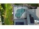 Aerial view of screened pool and solar panels on the roof at 16311 Colwood Dr, Odessa, FL 33556