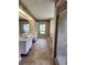 Spacious bathroom featuring double vanity sinks, walk in shower, and tile floors at 16311 Colwood Dr, Odessa, FL 33556