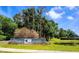The prestigious Eagles community entrance with lush landscaping and pond at 16311 Colwood Dr, Odessa, FL 33556