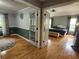 Inviting living room with beautiful hardwood floors that flow into a charming bedroom space at 16311 Colwood Dr, Odessa, FL 33556