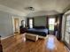 Spacious main bedroom with hardwood floors, ensuite bathroom, and ample natural light through windows at 16311 Colwood Dr, Odessa, FL 33556