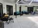 Outdoor patio with ample seating, perfect for relaxing and entertaining guests at 16311 Colwood Dr, Odessa, FL 33556