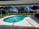 A screened-in pool with an attached lanai offering views of the golf course at 16311 Colwood Dr, Odessa, FL 33556