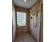 Updated bathroom showcasing a tiled standing shower with dual shower heads and a glass block window at 16311 Colwood Dr, Odessa, FL 33556