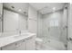Contemporary bathroom featuring a glass shower and white vanity with great lighting, stylish fixtures, and an updated design at 301 1St S St # 1605, St Petersburg, FL 33701