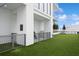 Fenced dog park area with artificial turf, providing a secure and clean space for pets to play and socialize at 301 1St S St # 1605, St Petersburg, FL 33701