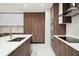 Well-appointed kitchen featuring stainless steel appliances, quartz countertop, and modern cabinets at 301 1St S St # 1605, St Petersburg, FL 33701
