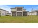 Well-maintained backyard with a spacious covered patio at 32346 Sapna Chime Dr, Wesley Chapel, FL 33545