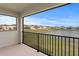 Balcony view overlooking a tranquil pond and residential area at 32346 Sapna Chime Dr, Wesley Chapel, FL 33545