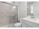 Modern bathroom with a glass door shower, light countertops, and updated fixtures at 32346 Sapna Chime Dr, Wesley Chapel, FL 33545