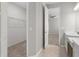 En suite bathroom features a double vanity and walk-in closet at 32346 Sapna Chime Dr, Wesley Chapel, FL 33545